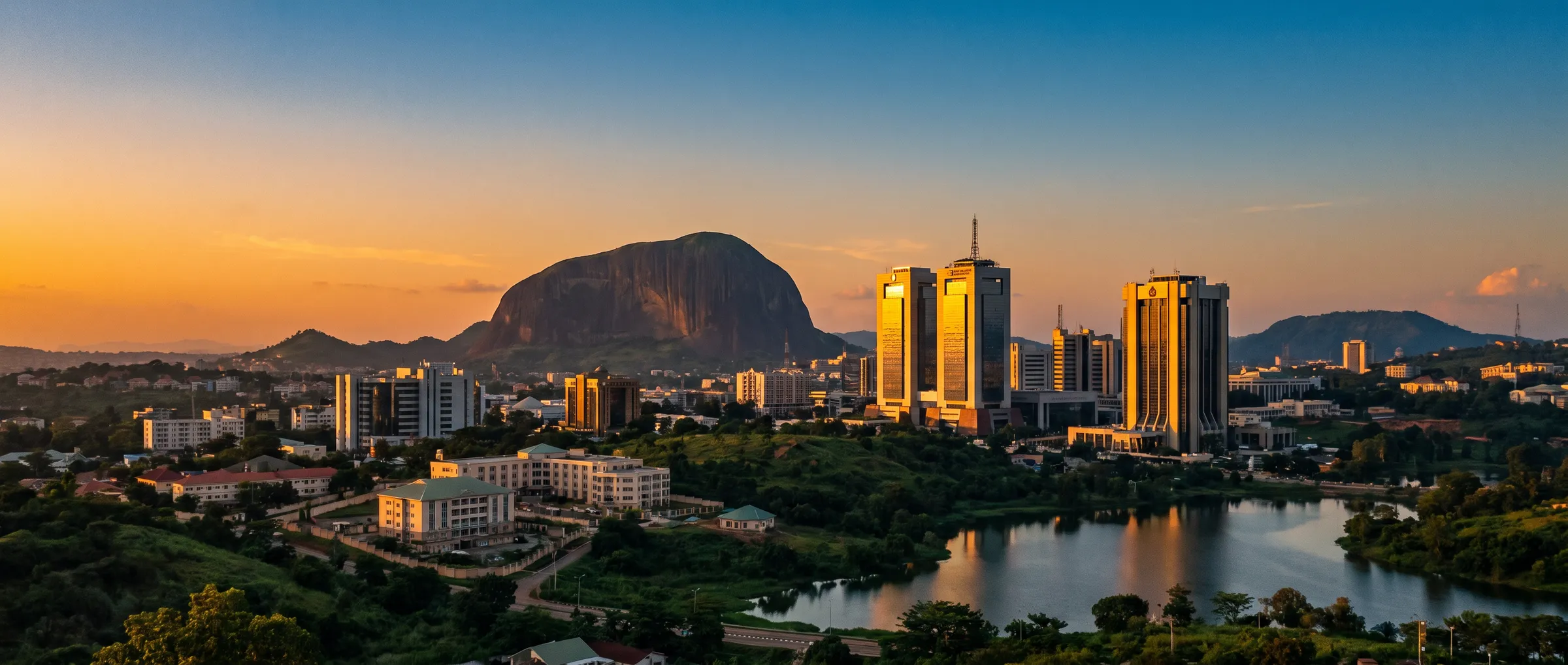 Abuja skyline at golden hour, with Aso Rock in the distance