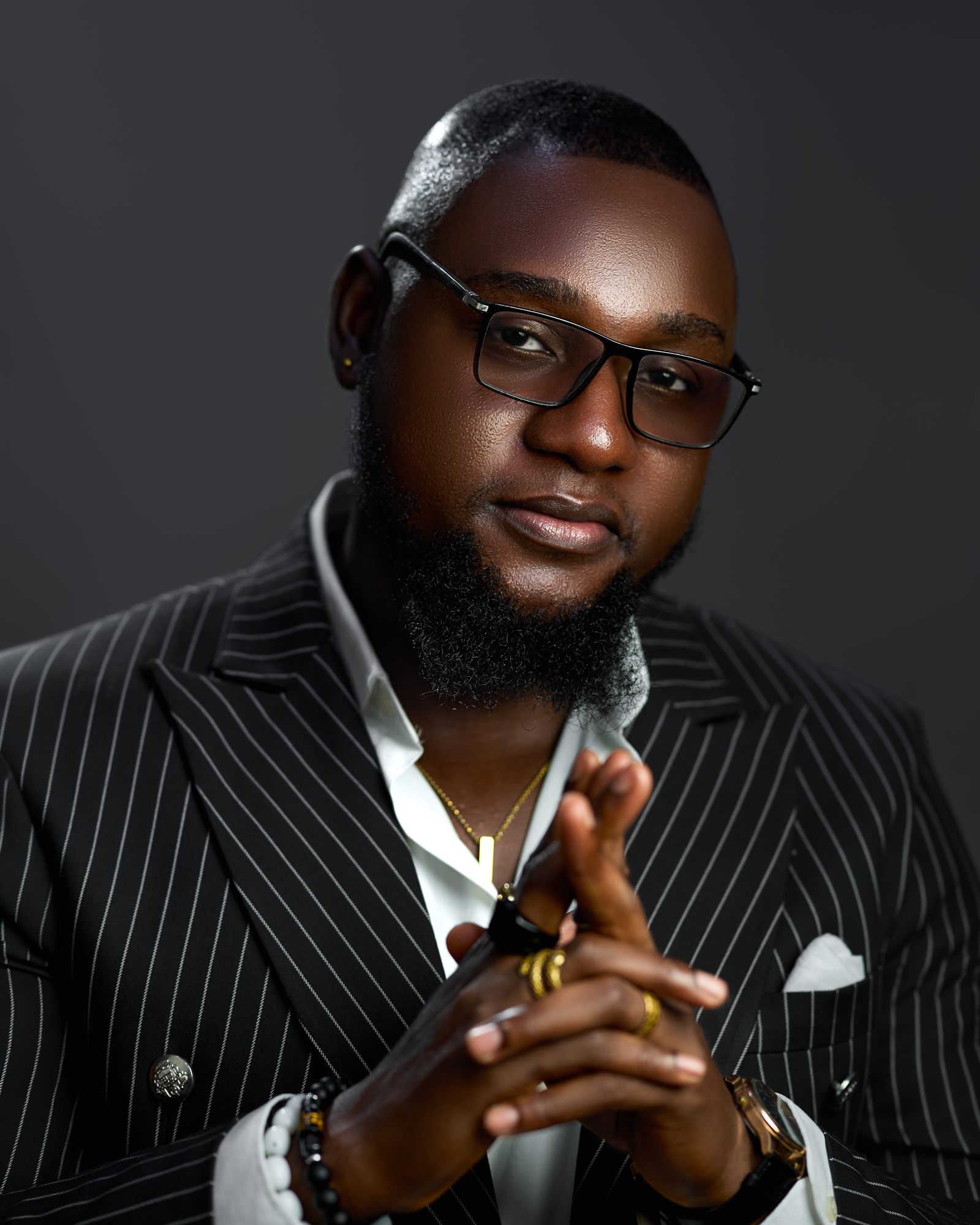 Levi Henry, founder of Levi Henry Group, in a pinstripe suit
